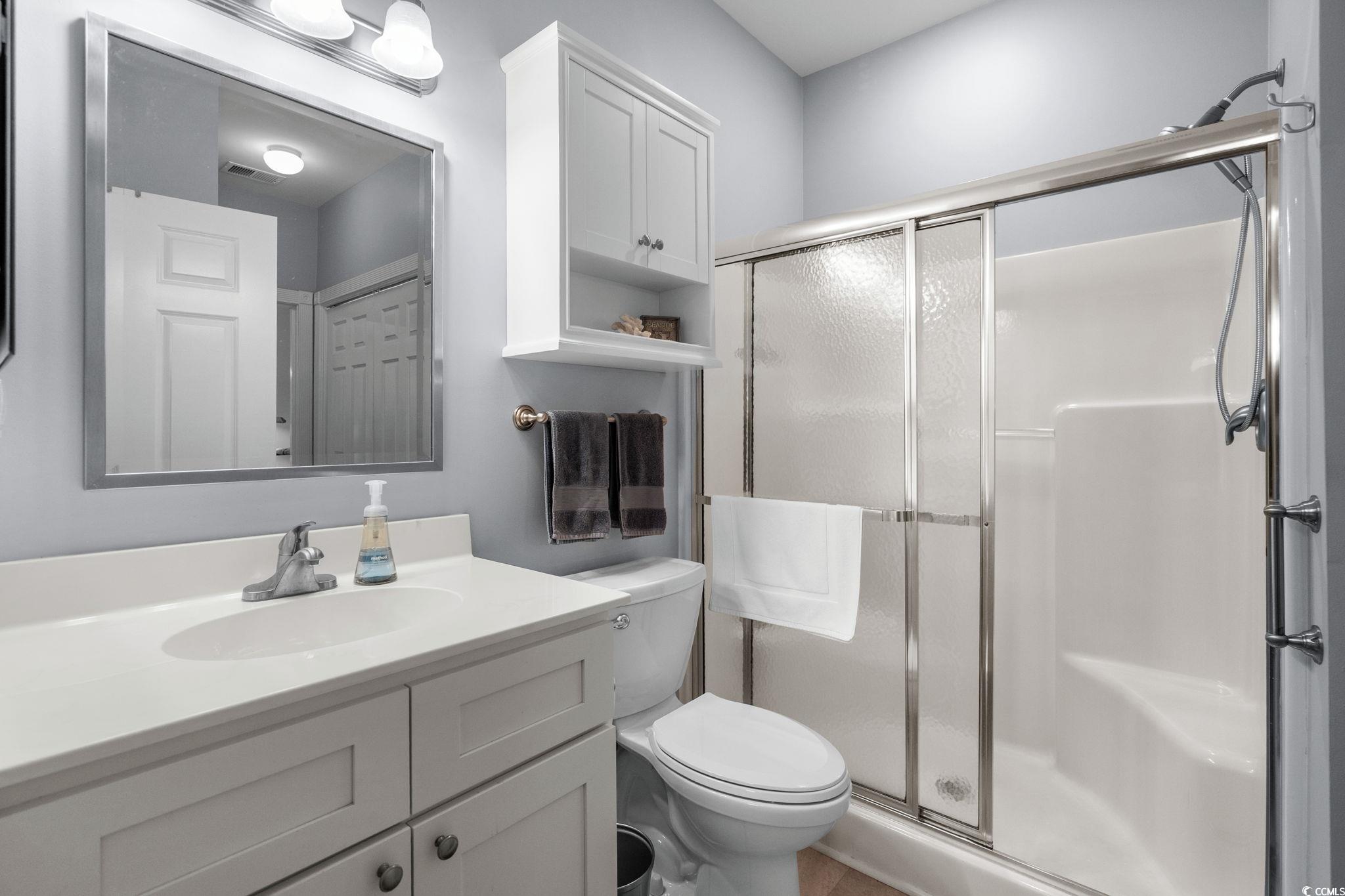 4885 Magnolia Pointe Lane, Unit 304 Myrtle Beach, SC 29577 - Photo 23 of 39 Full bathroom featuring vanity and a stall shower