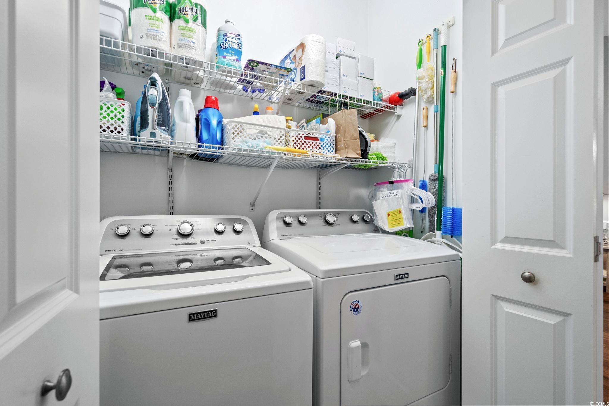 4885 Magnolia Pointe Lane, Unit 304 Myrtle Beach, SC 29577 - Photo 24 of 39 Laundry area featuring washer and dryer