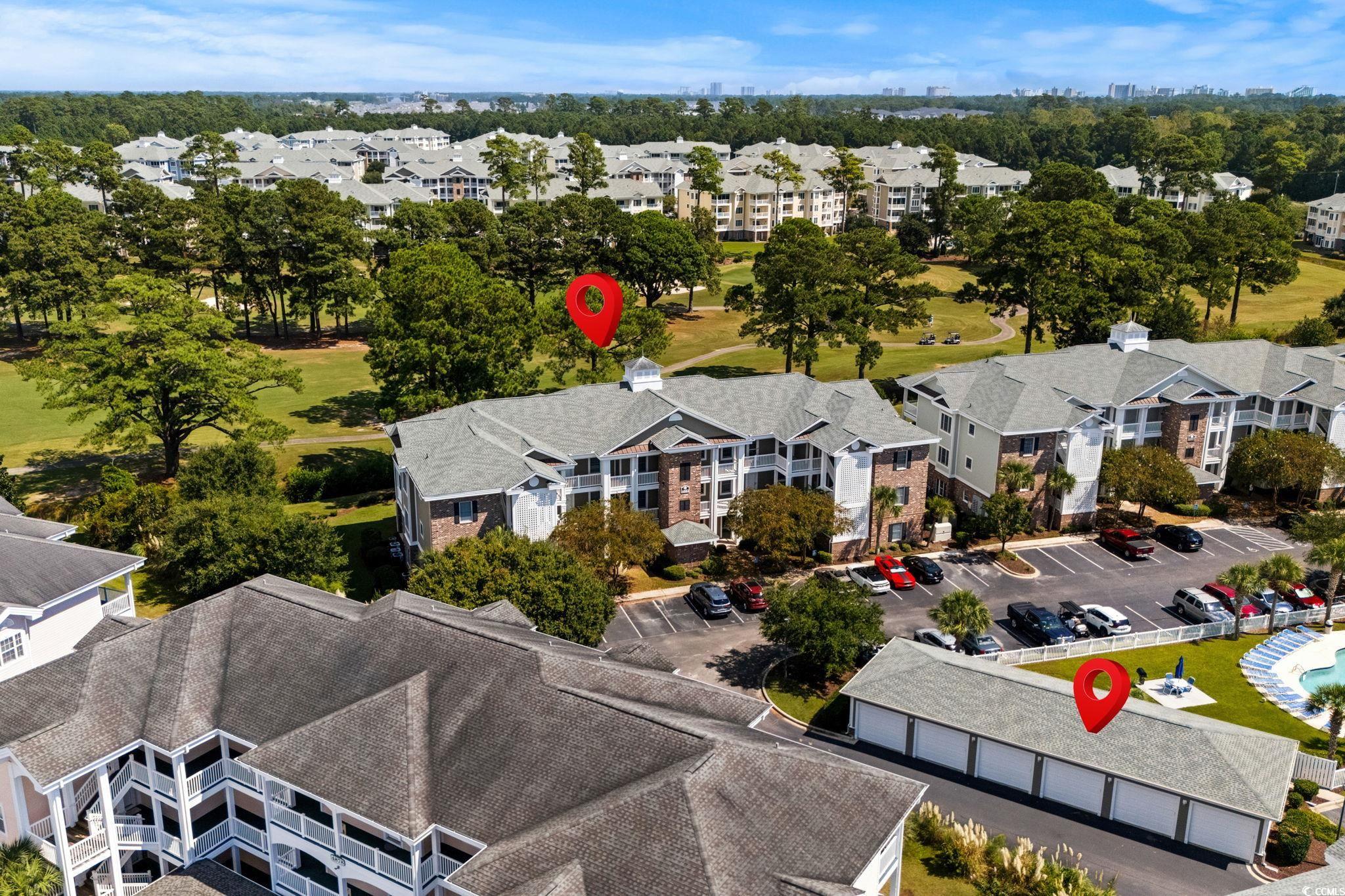 4885 Magnolia Pointe Lane, Unit 304 Myrtle Beach, SC 29577 - Photo 4 of 39 Aerial view of apartment complex and a golf club