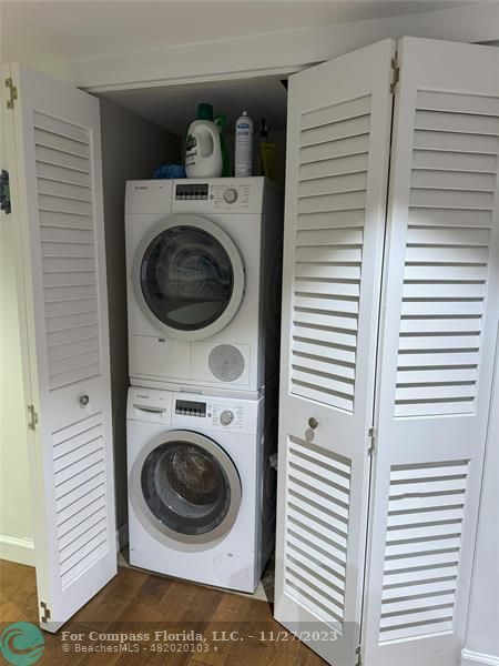8877 Collins Avenue, Unit 307 Surfside, FL 33154 - Photo 14 of 15 a utility room with dryer and washer