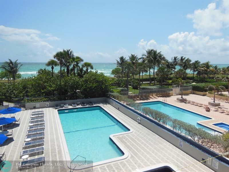 8877 Collins Avenue, Unit 307 Surfside, FL 33154 - Photo 15 of 15 a view of swimming pool with chairs