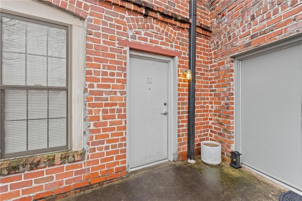 644 Wells Street Southwest, Unit 10 Atlanta, GA 30310 - Photo 20 of 46 a view of a door and brick wall