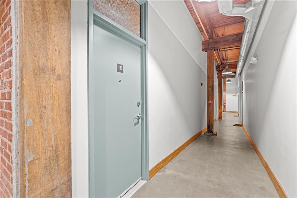 644 Wells Street Southwest, Unit 10 Atlanta, GA 30310 - Photo 3 of 46 a view of a hallway with a white door