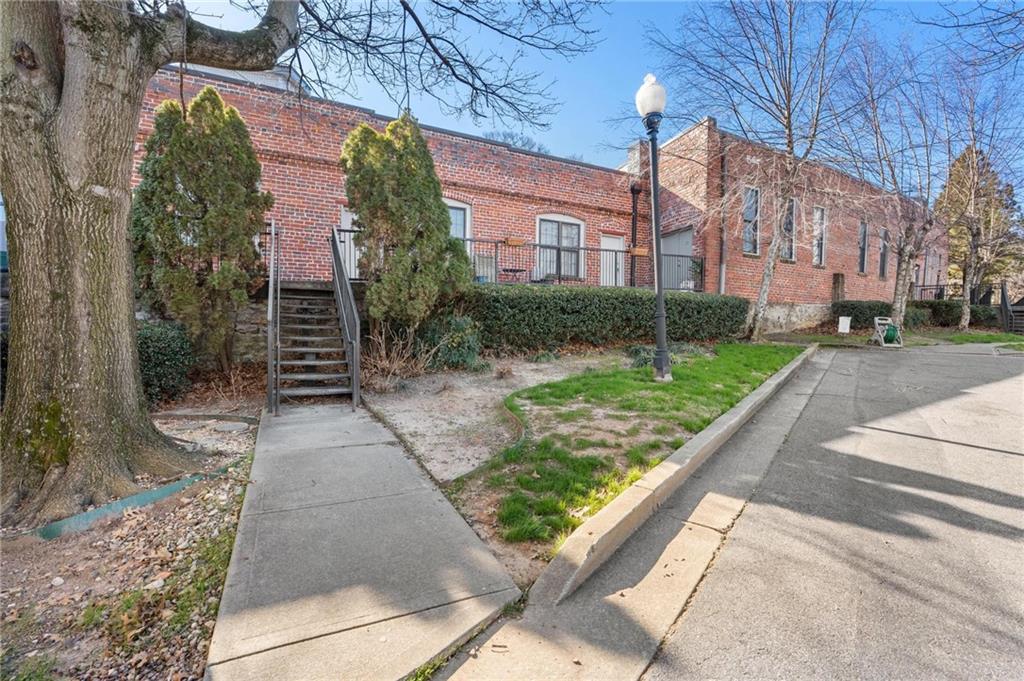 644 Wells Street Southwest, Unit 10 Atlanta, GA 30310 - Photo 39 of 46 a view of a building with a yard