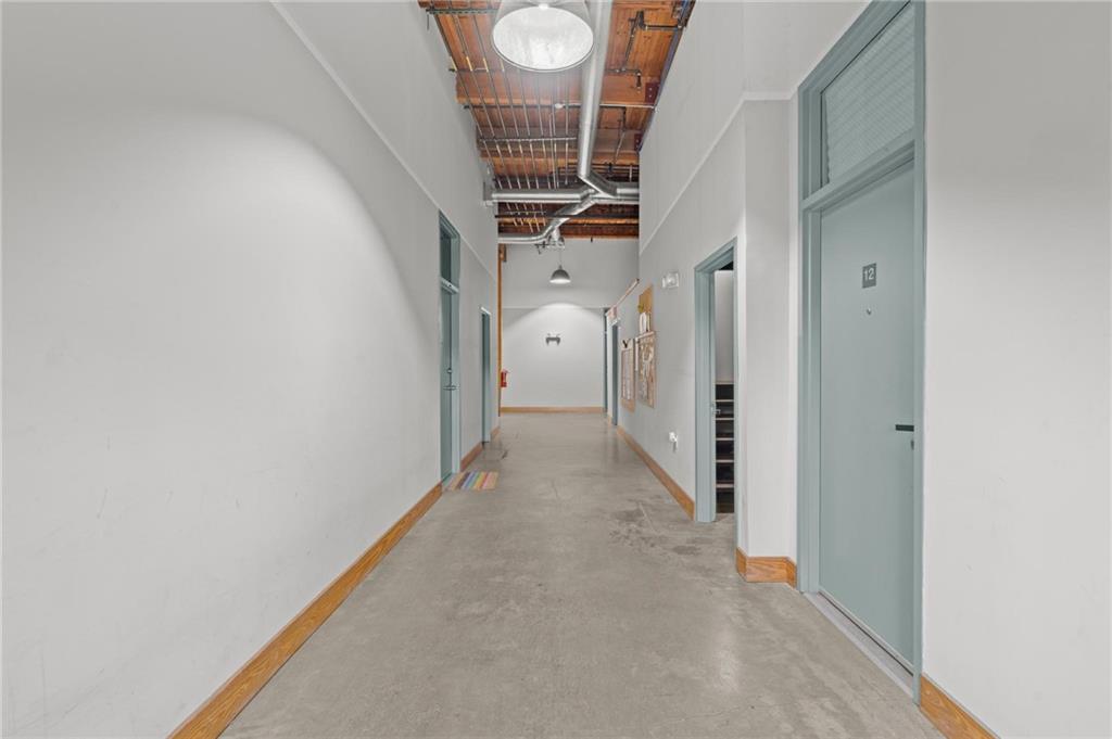 644 Wells Street Southwest, Unit 10 Atlanta, GA 30310 - Photo 5 of 46 a view of a hallway with wooden floor and entryway
