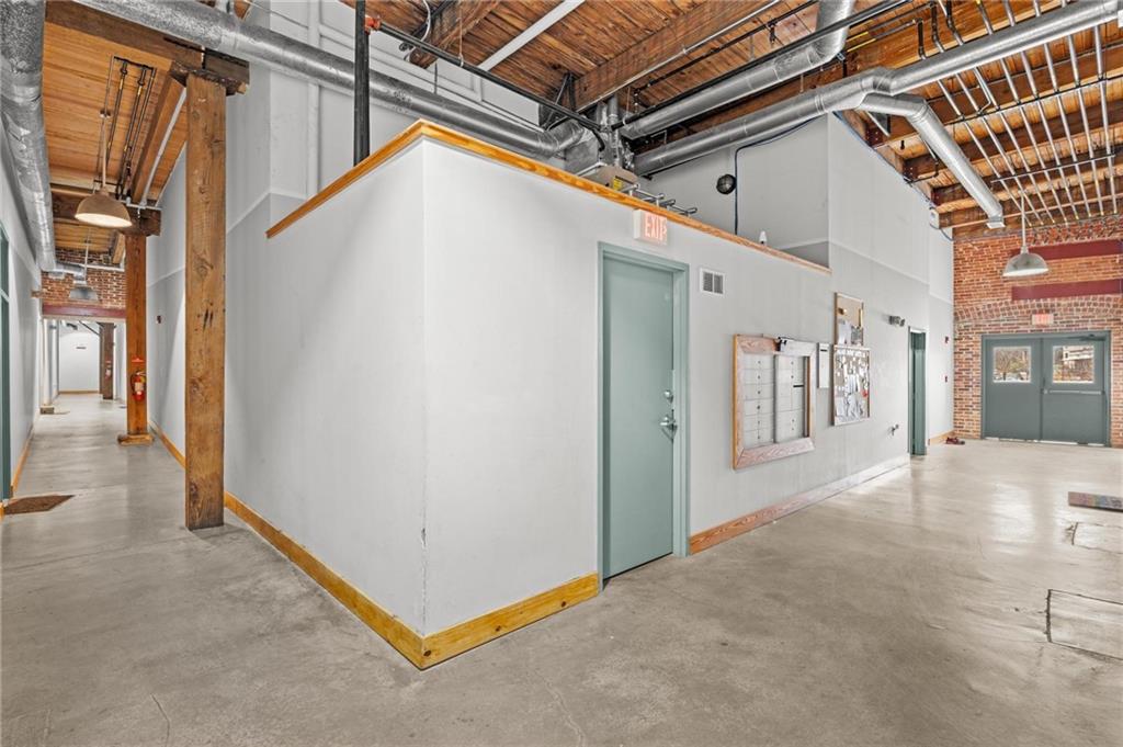 644 Wells Street Southwest, Unit 10 Atlanta, GA 30310 - Photo 10 of 46 a view of a hallway with a glass door