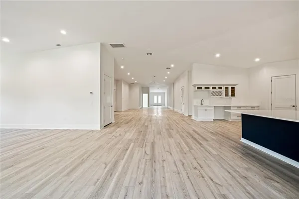 a view of kitchen and kitchen with wooden floor