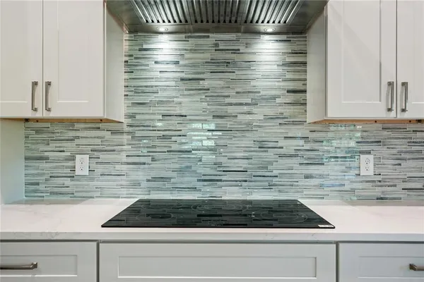 a bathroom with a granite countertop window