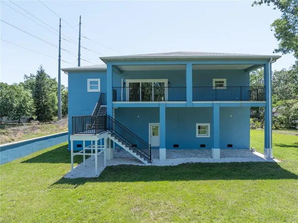 a aerial view of a house with a yard