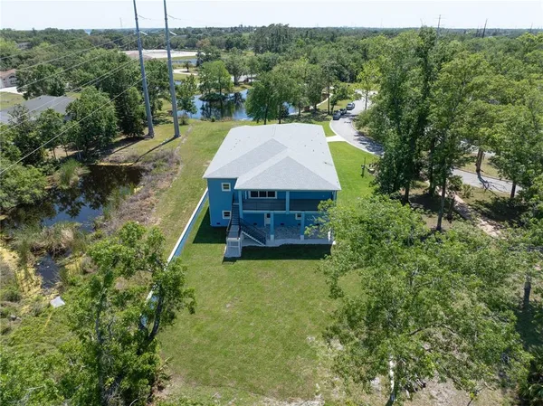 a aerial view of a house with pool