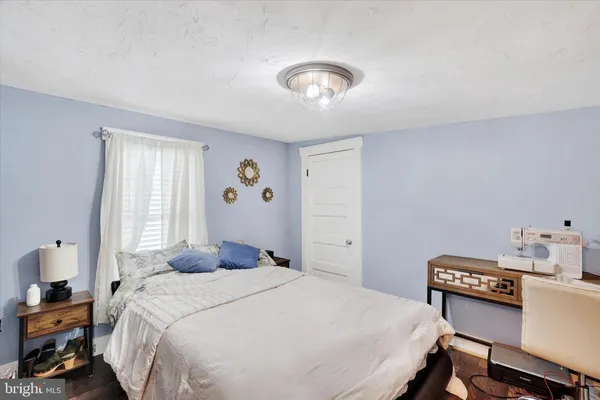 a bedroom with a bed and a table in it
