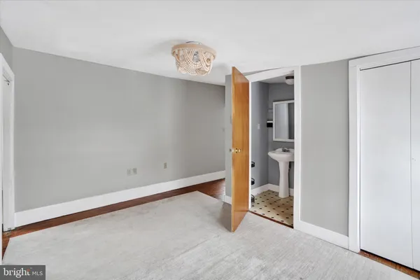 a kitchen with stainless steel appliances granite countertop a sink and a refrigerator
