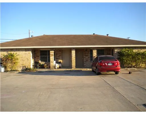 a view of a car parked in front of a building