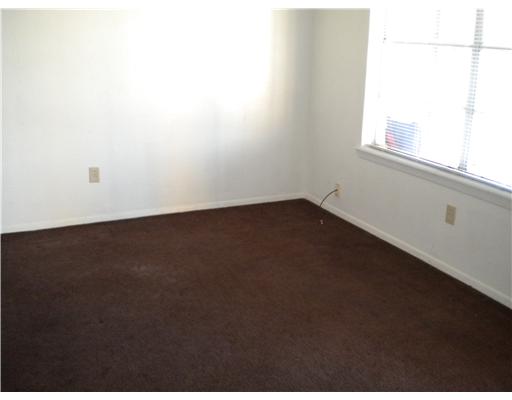 945 Quetzal Street, Unit 3 Corpus Christi, TX 78418 - Photo 4 of 10 a view of an empty room with a window