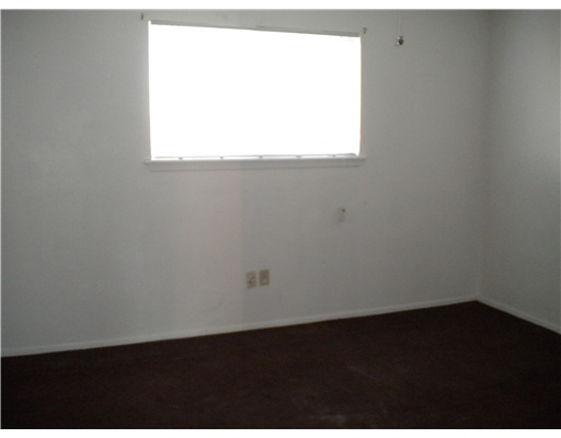 945 Quetzal Street, Unit 3 Corpus Christi, TX 78418 - Photo 7 of 10 a view of a small space with wooden floor and a window