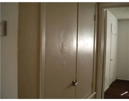 a close up of a stove and a refrigerator