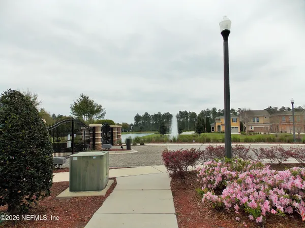 a view of a garden with sitting area