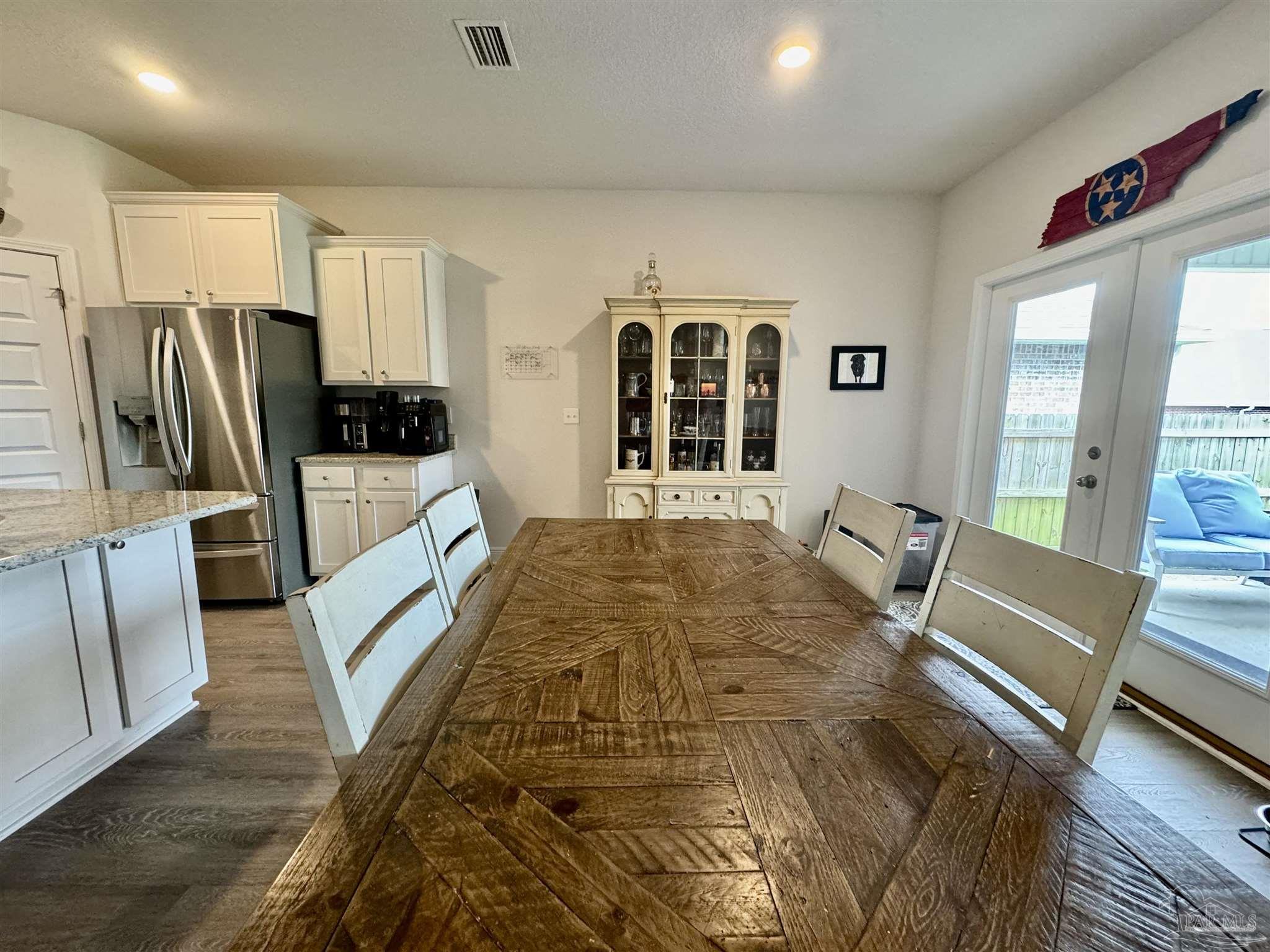 7787 Burnside Loop Pensacola, FL 32526 - Photo 15 of 32 a bed sitting in a room next to a large window