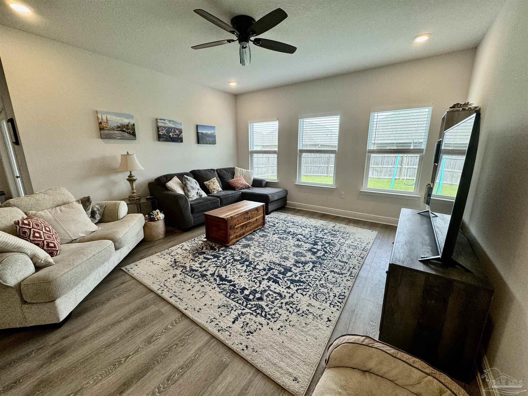 7787 Burnside Loop Pensacola, FL 32526 - Photo 18 of 32 a living room with furniture and a rug