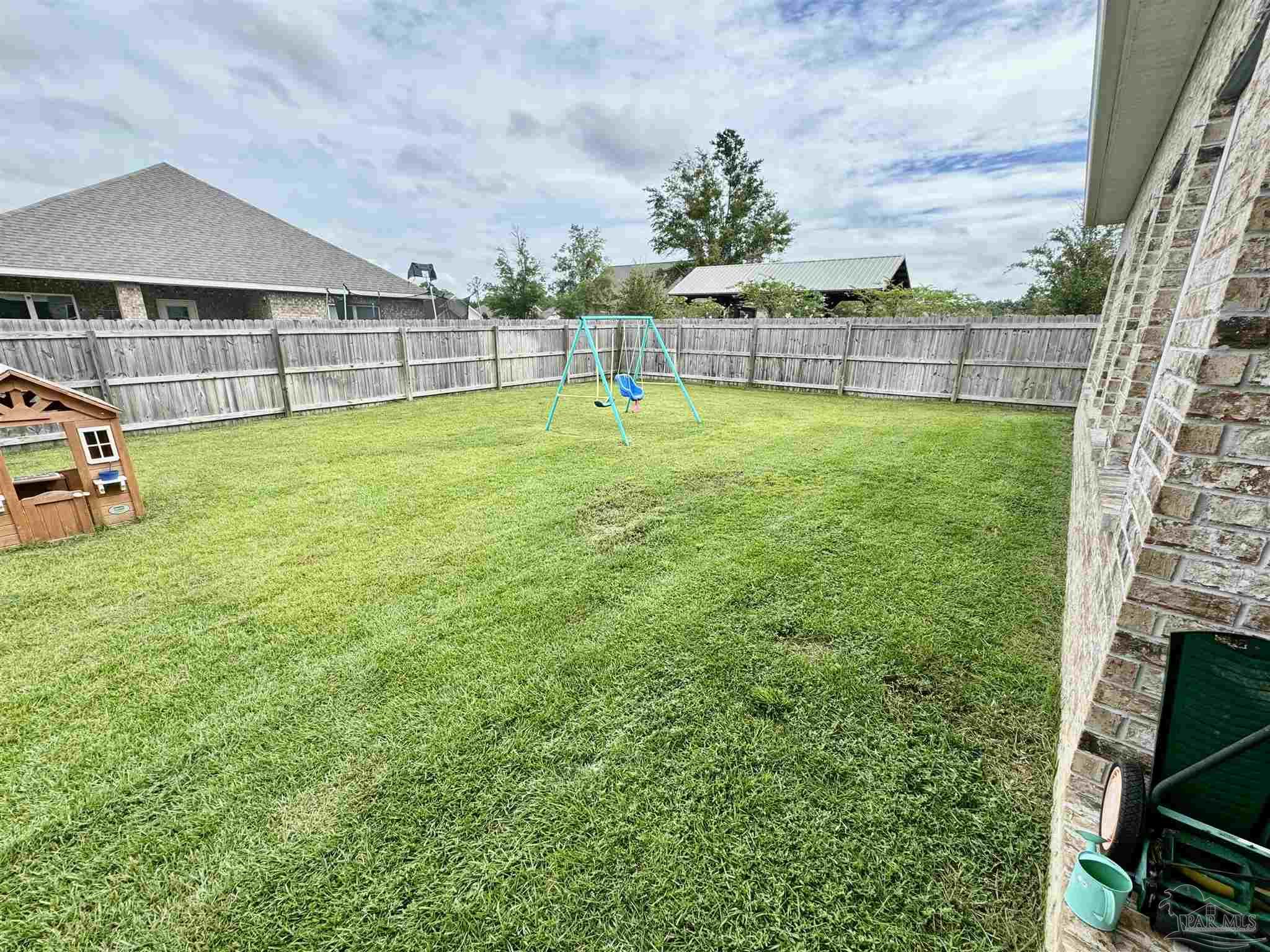 7787 Burnside Loop Pensacola, FL 32526 - Photo 27 of 32 a view of a house with a big yard and sitting area