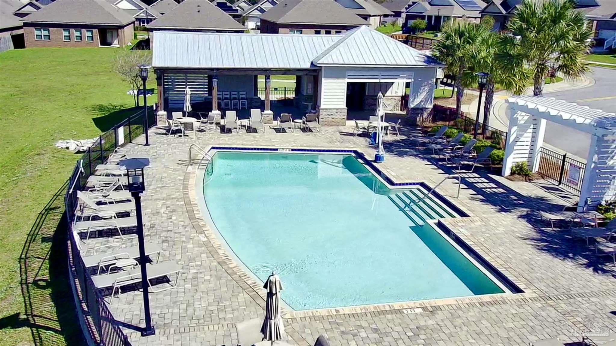 7787 Burnside Loop Pensacola, FL 32526 - Photo 4 of 32 swimming pool view with a seating space