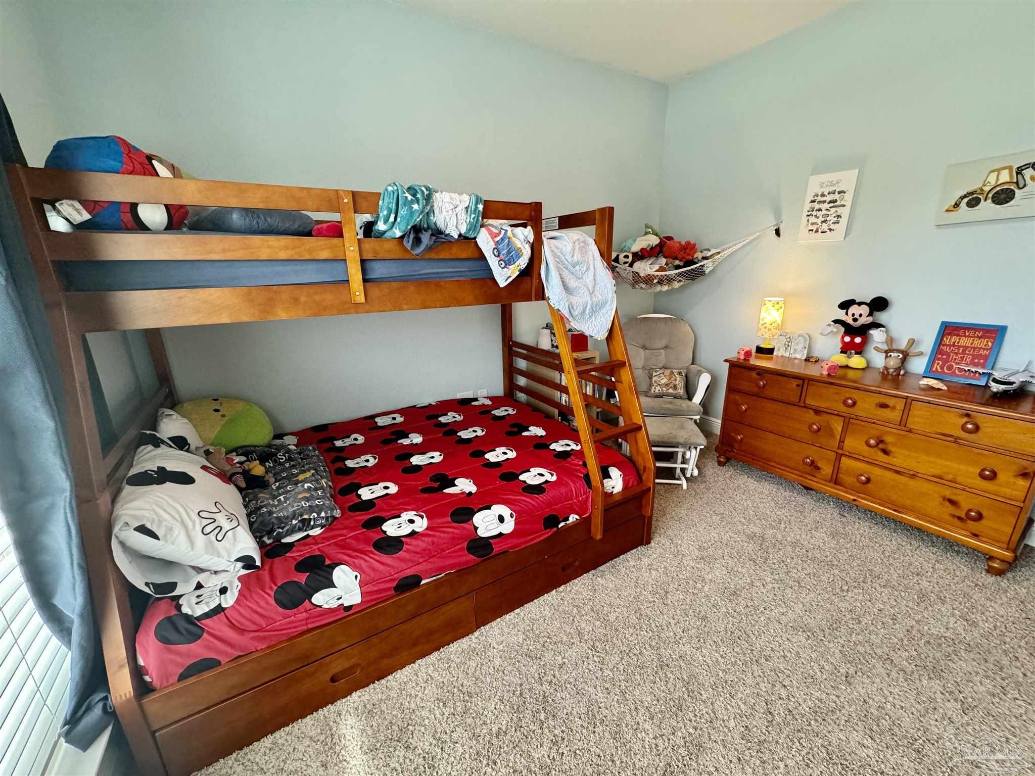 7787 Burnside Loop Pensacola, FL 32526 - Photo 5 of 32 a bedroom with baby bed and dresser