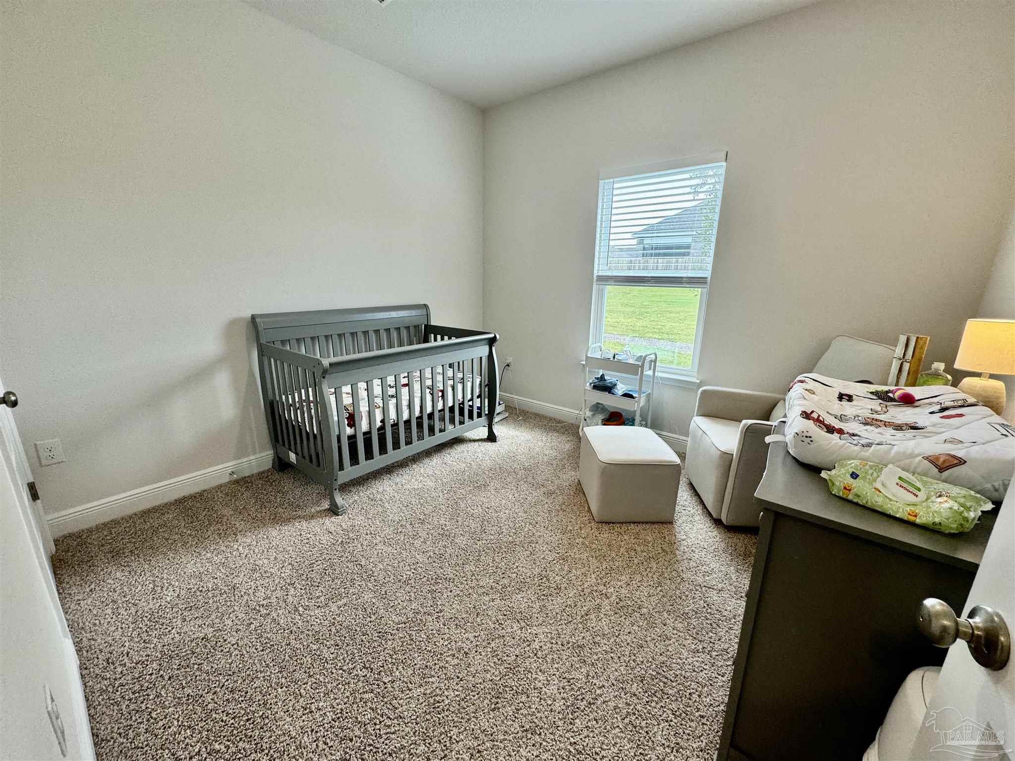 7787 Burnside Loop Pensacola, FL 32526 - Photo 9 of 32 a bedroom with furniture and a window