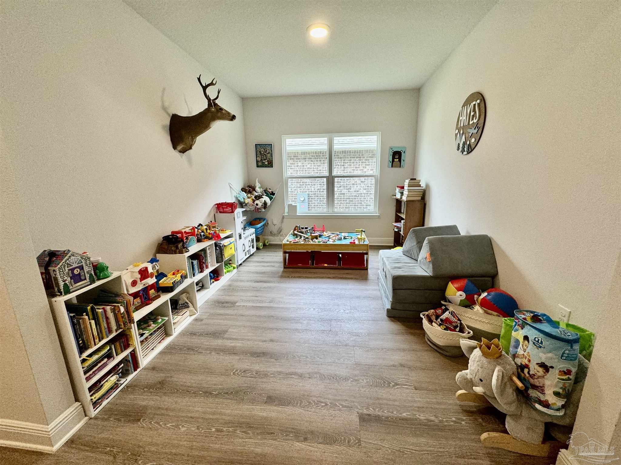 7787 Burnside Loop Pensacola, FL 32526 - Photo 10 of 32 a living room with furniture and a wooden floor