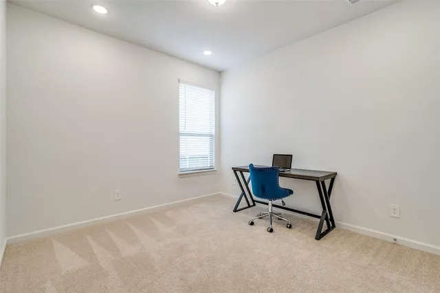 a workspace with furniture and a window