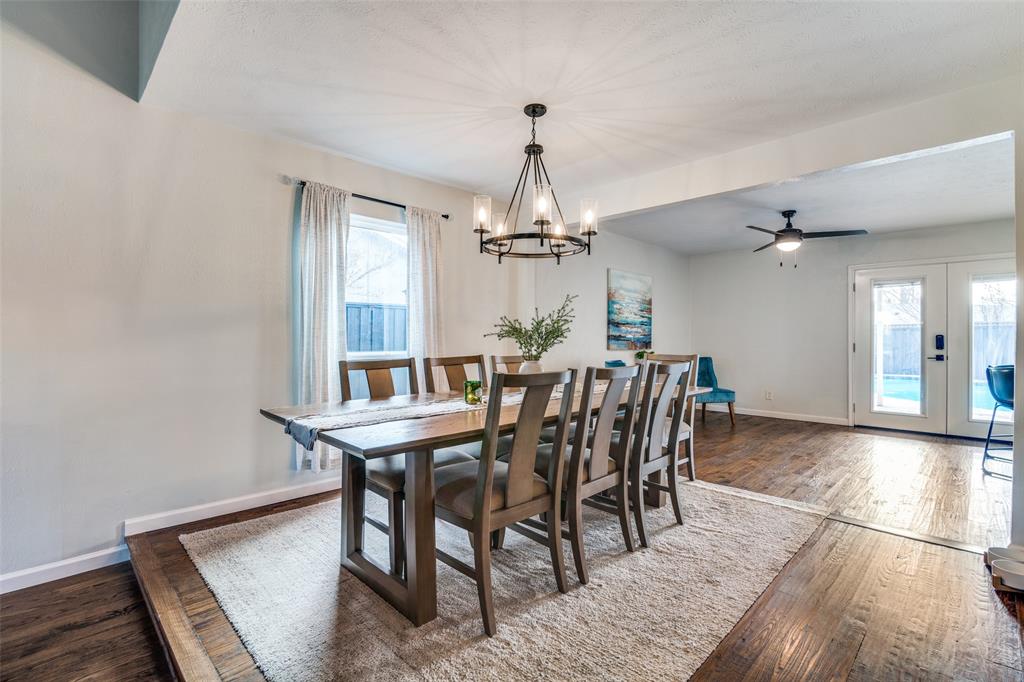 4225 Wayfaring Street Mesquite, TX 75150 - Photo 9 of 26 a dining room with furniture a chandelier and wooden floor