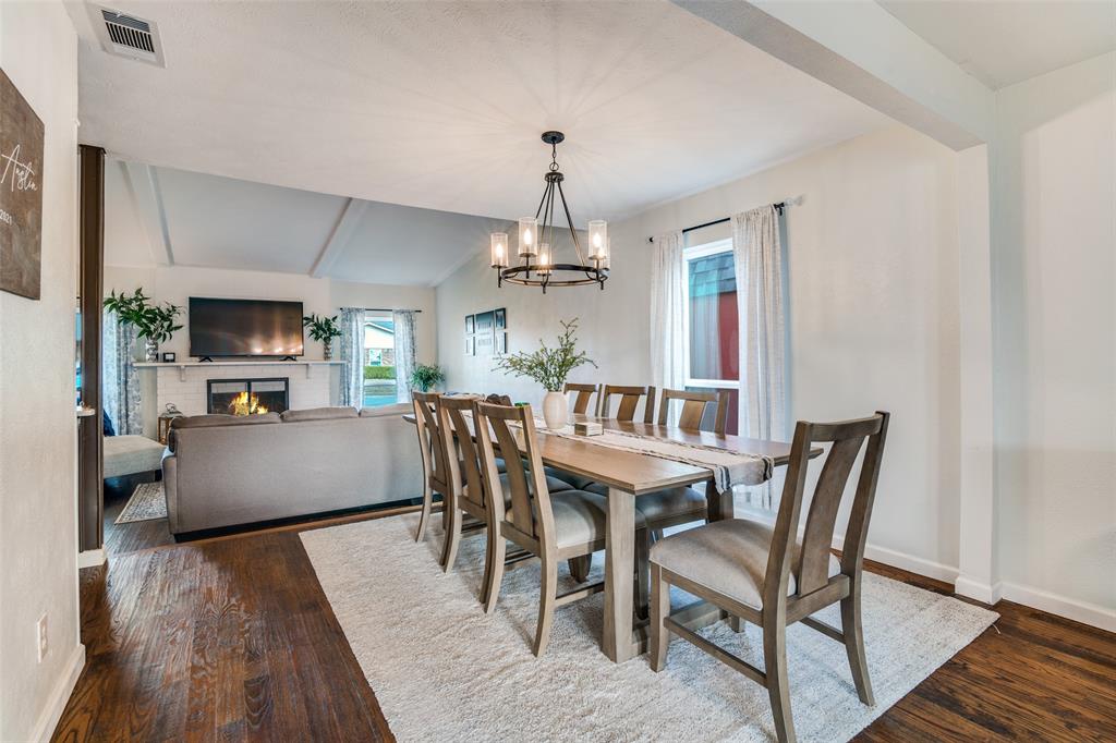 4225 Wayfaring Street Mesquite, TX 75150 - Photo 10 of 26 a view of a dining room with furniture window and wooden floor