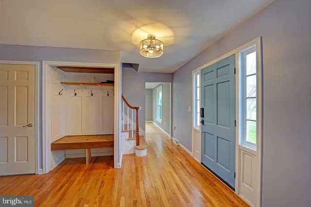 a view of room with furniture and wooden floor