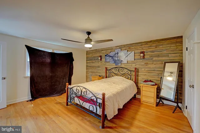 a bedroom with a bed and a table