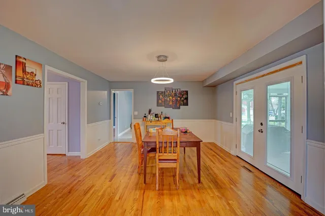 a view of a room with wooden floor and iron stairs