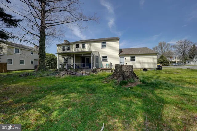 a view of a house with a yard porch and sitting area