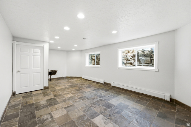 3535 Homestead Road Park City, UT 84098 - Photo 60 of 81 Spacious room featuring slate-style floor tiling, recessed lighting, and multiple windows