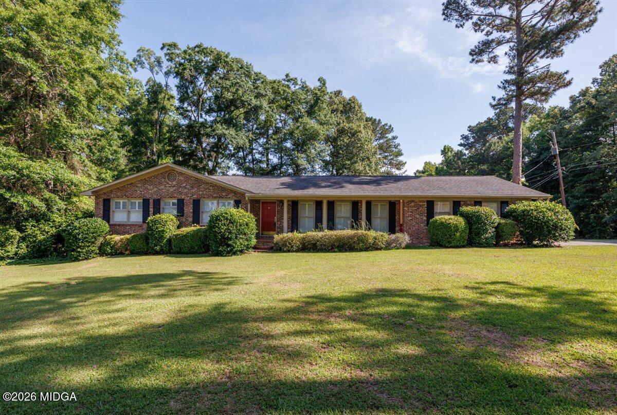 335 Hamrick Road Macon, GA 31220 - Photo 1 of 41 a front view of a house with a garden