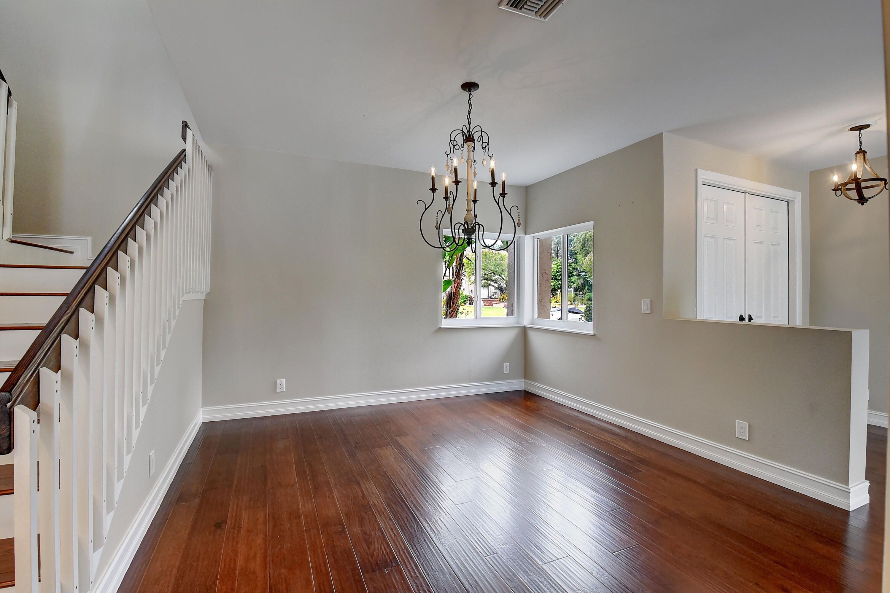 10599 Palm Spring Drive Boca Raton, FL 33428 - Photo 17 of 46 a view of a room with wooden floors and window
