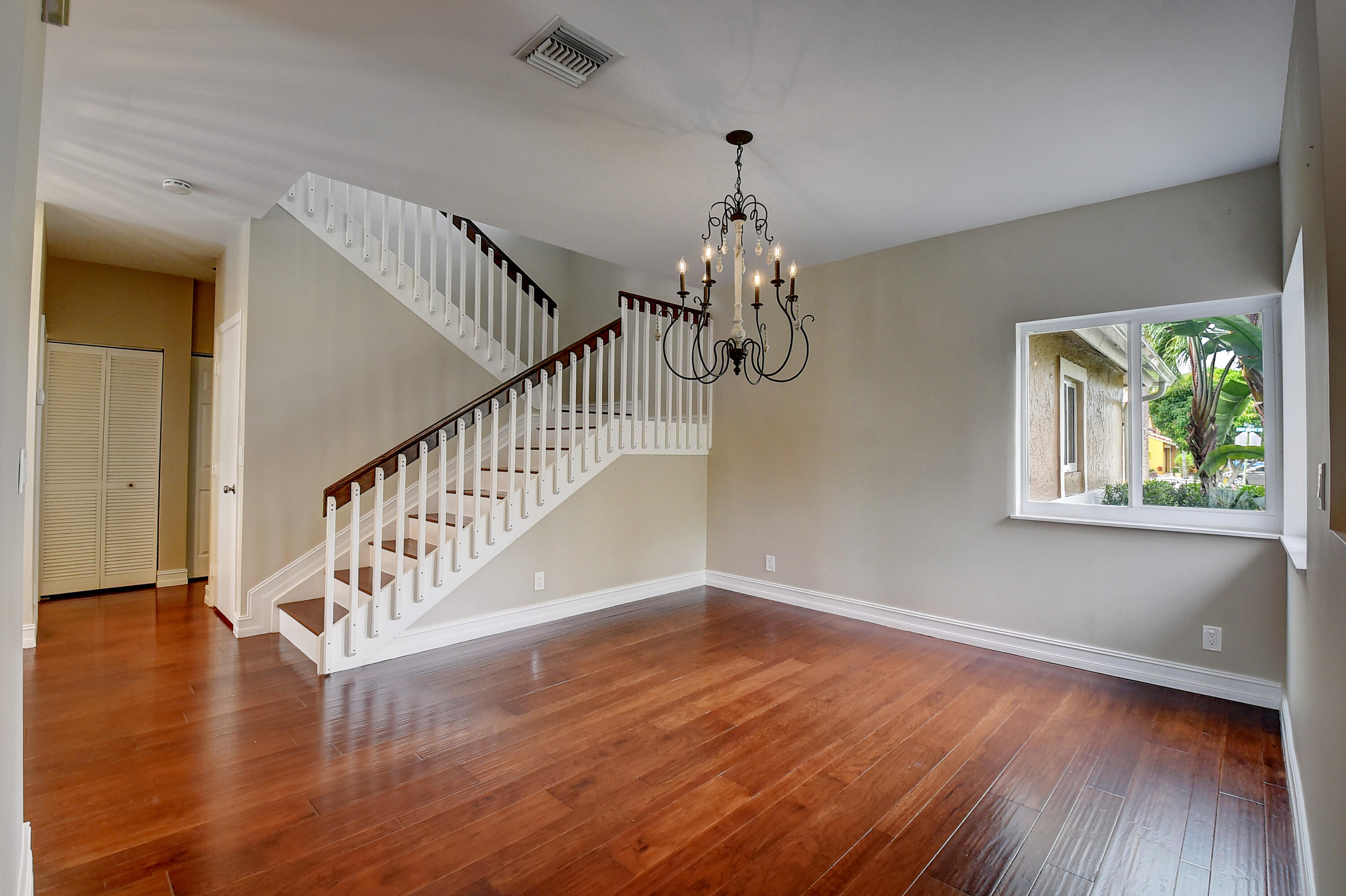 10599 Palm Spring Drive Boca Raton, FL 33428 - Photo 18 of 46 a view of entryway and hall with wooden floor