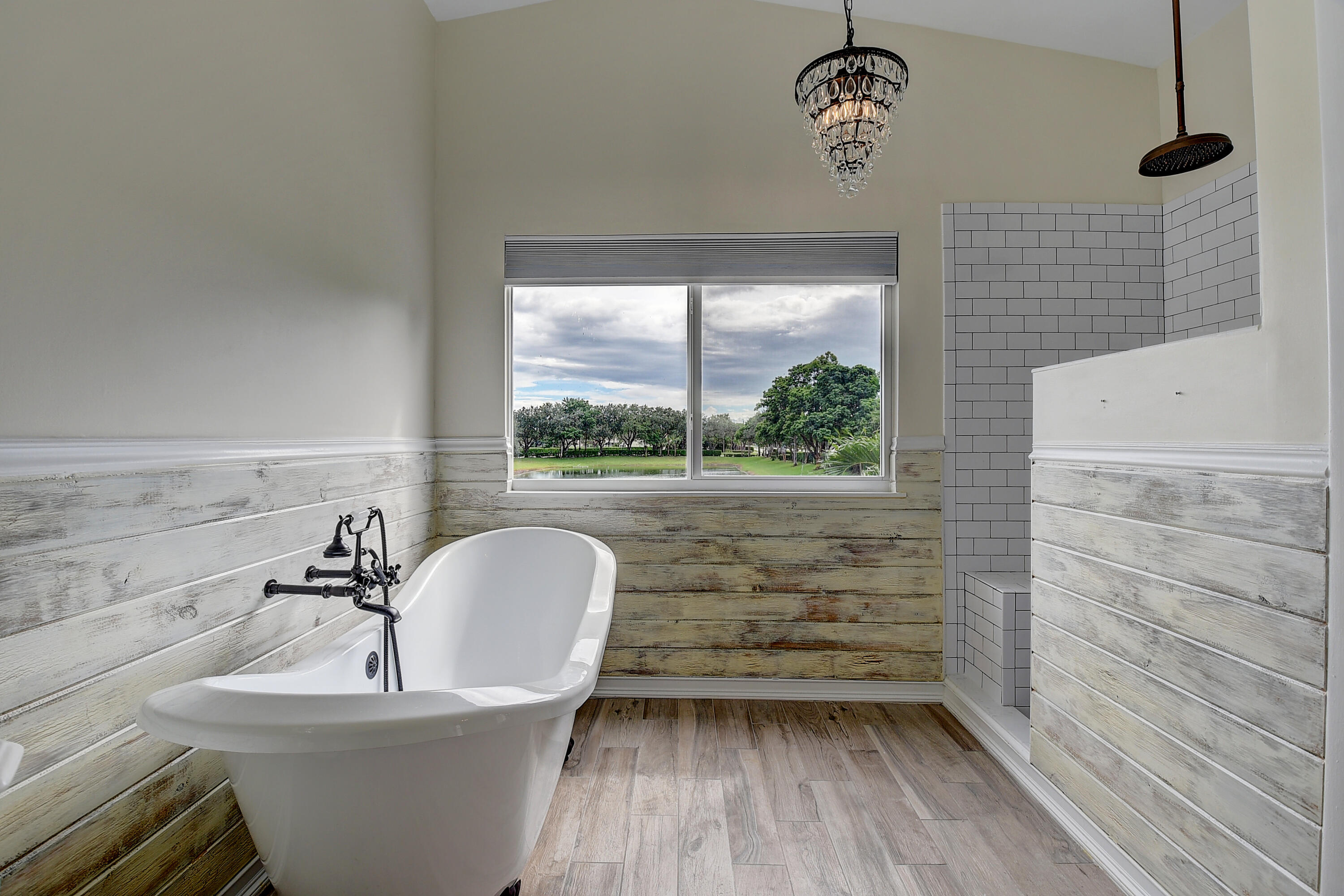 10599 Palm Spring Drive Boca Raton, FL 33428 - Photo 26 of 46 a bathroom with a sink a toilet and a window