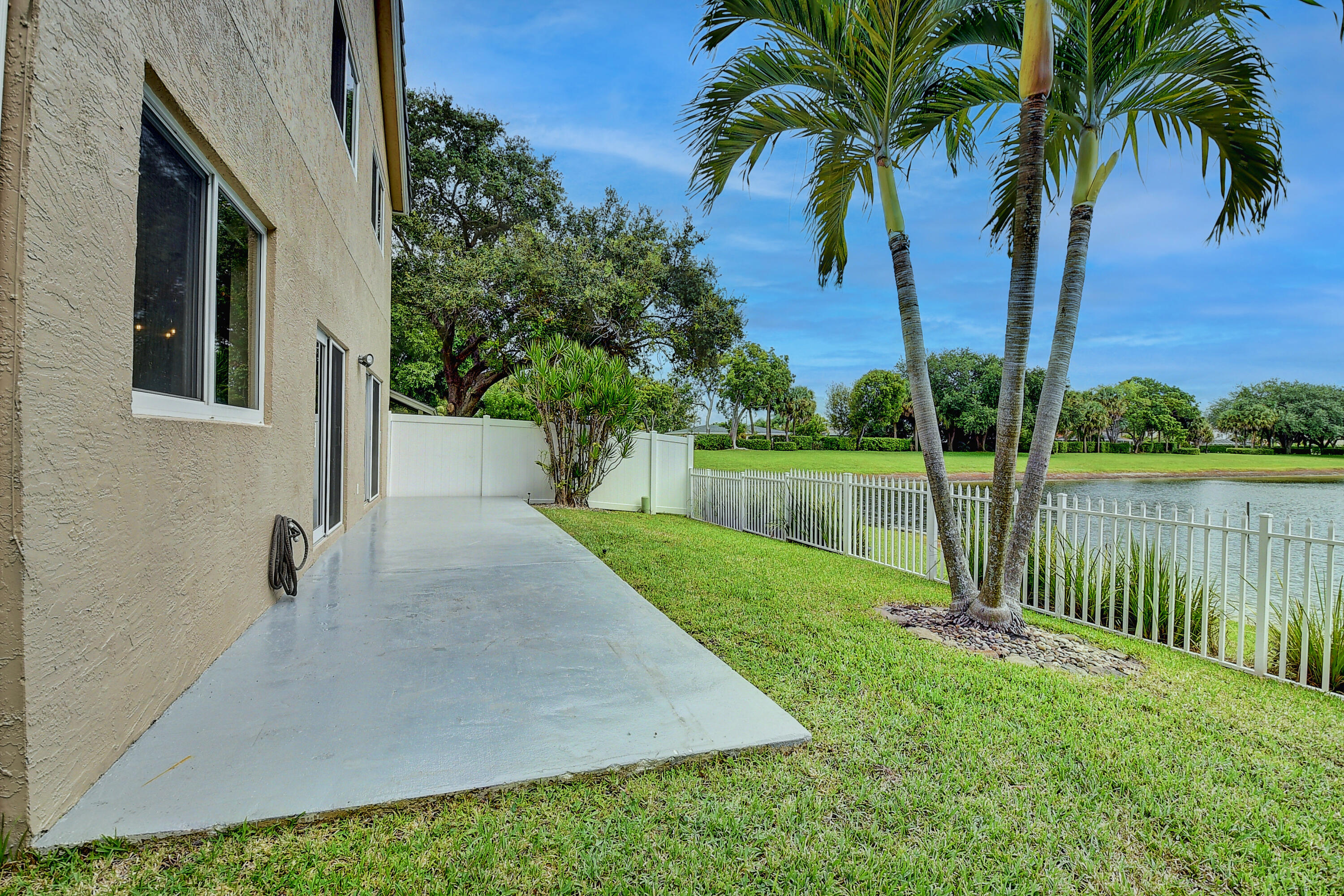 10599 Palm Spring Drive Boca Raton, FL 33428 - Photo 32 of 46 a view of a backyard with a garden