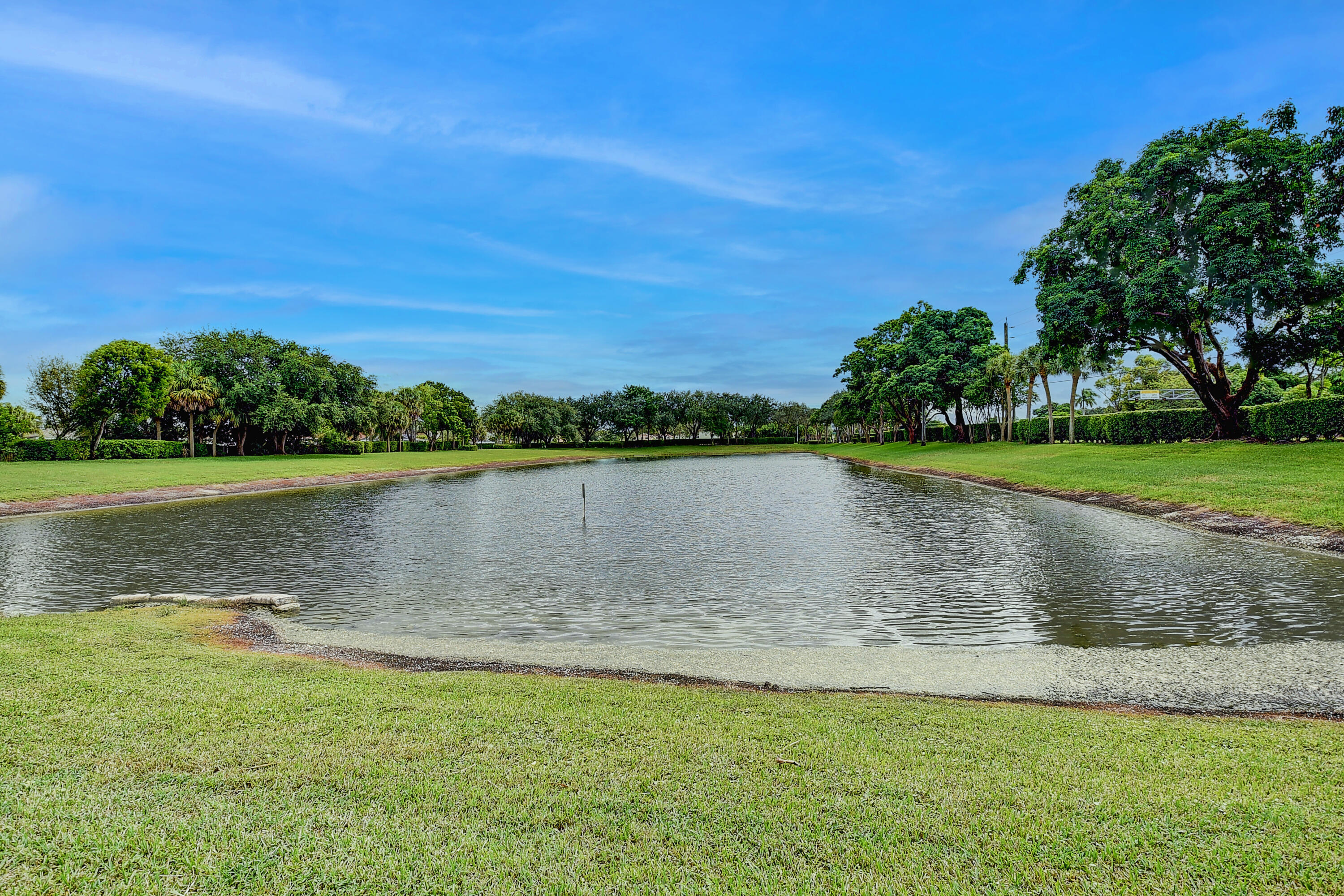 10599 Palm Spring Drive Boca Raton, FL 33428 - Photo 35 of 46 a view of a lake with a big yard