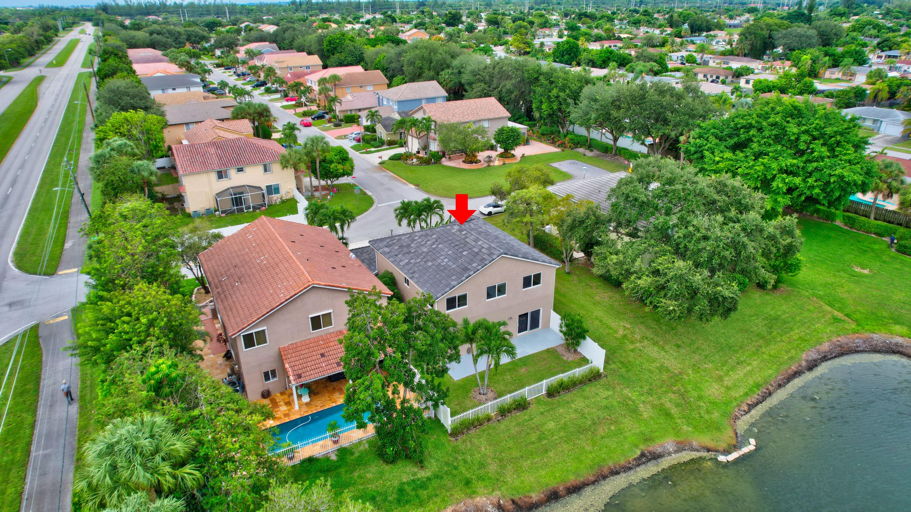 10599 Palm Spring Drive Boca Raton, FL 33428 - Photo 43 of 46 an aerial view of multiple houses with yard