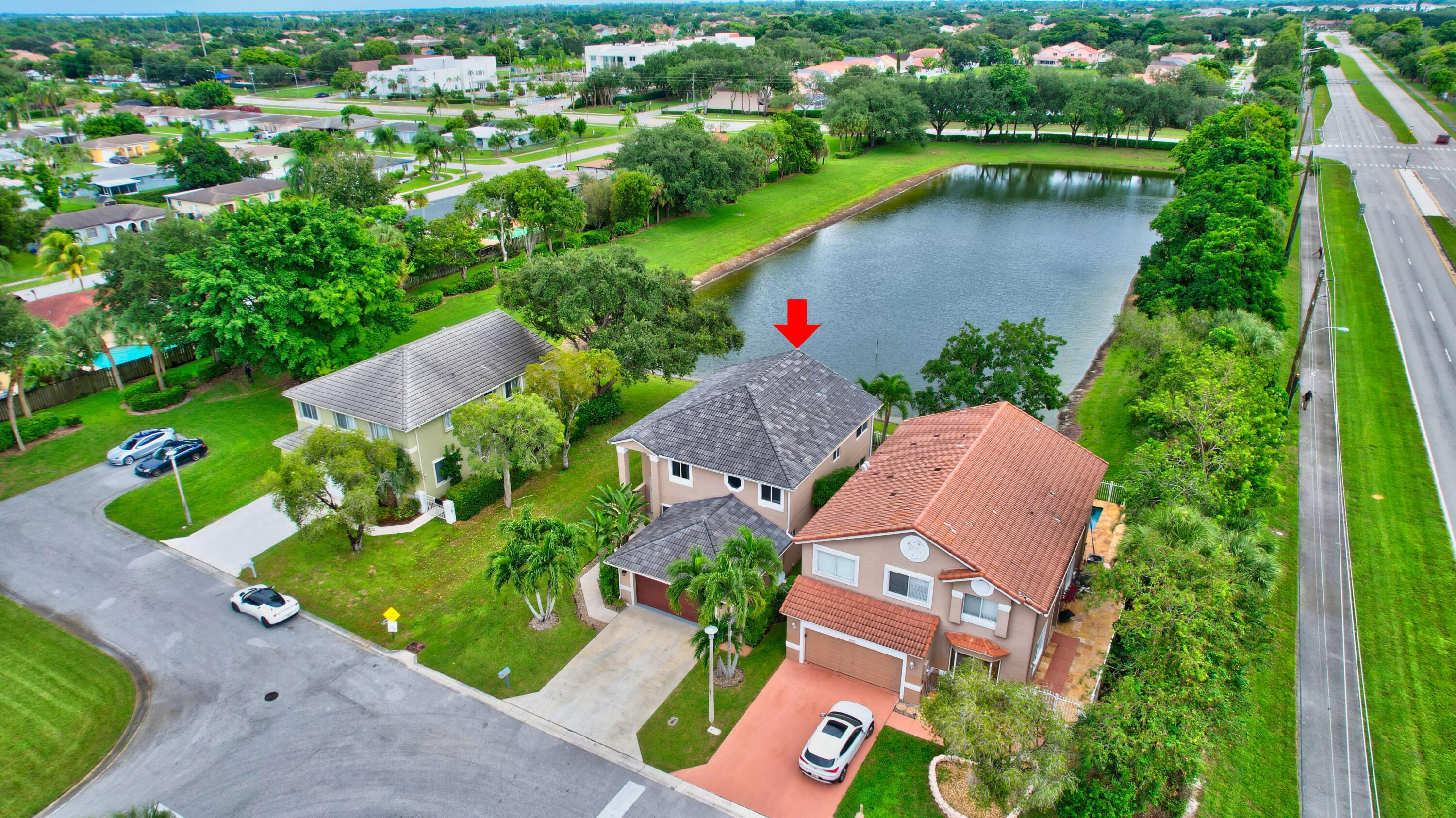 10599 Palm Spring Drive Boca Raton, FL 33428 - Photo 44 of 46 an aerial view of a house with outdoor space and street view