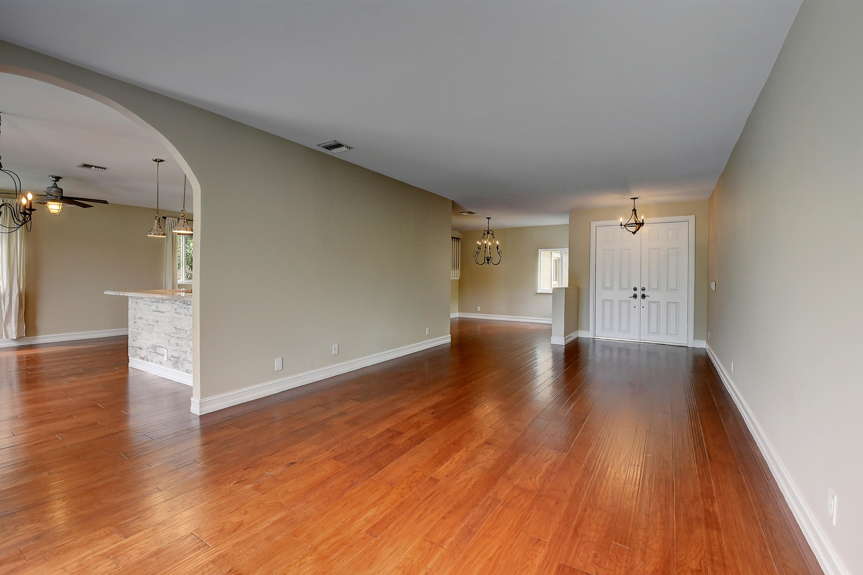 10599 Palm Spring Drive Boca Raton, FL 33428 - Photo 8 of 46 wooden floor in an empty room