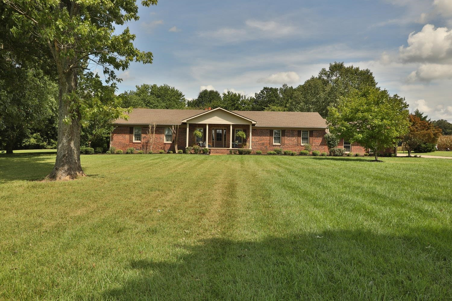 529 Vancleave Road Martin, TN 38237 - Photo 1 of 20 a view of a house with a big yard and large trees