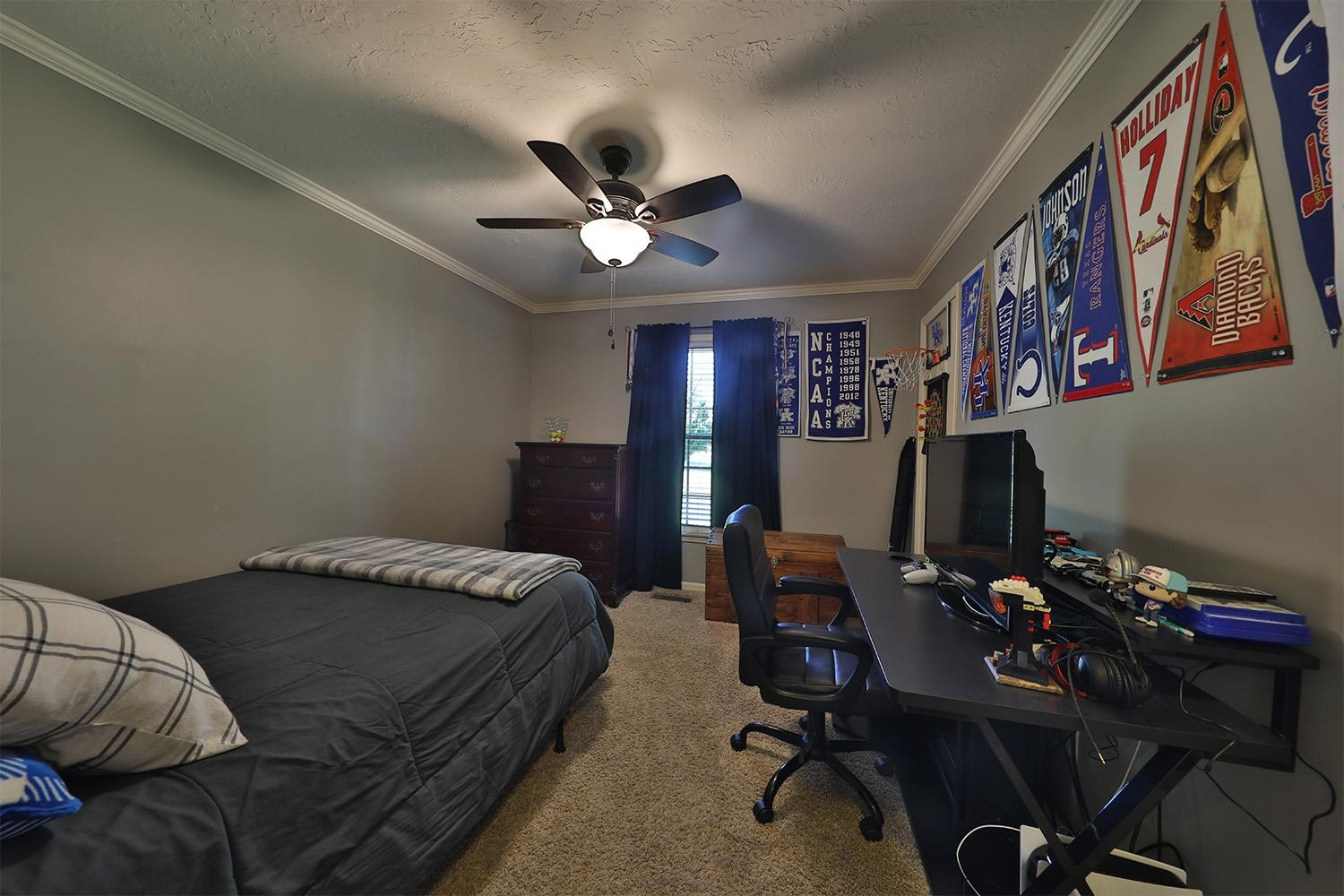 529 Vancleave Road Martin, TN 38237 - Photo 11 of 20 a bedroom with a bed and a chandelier