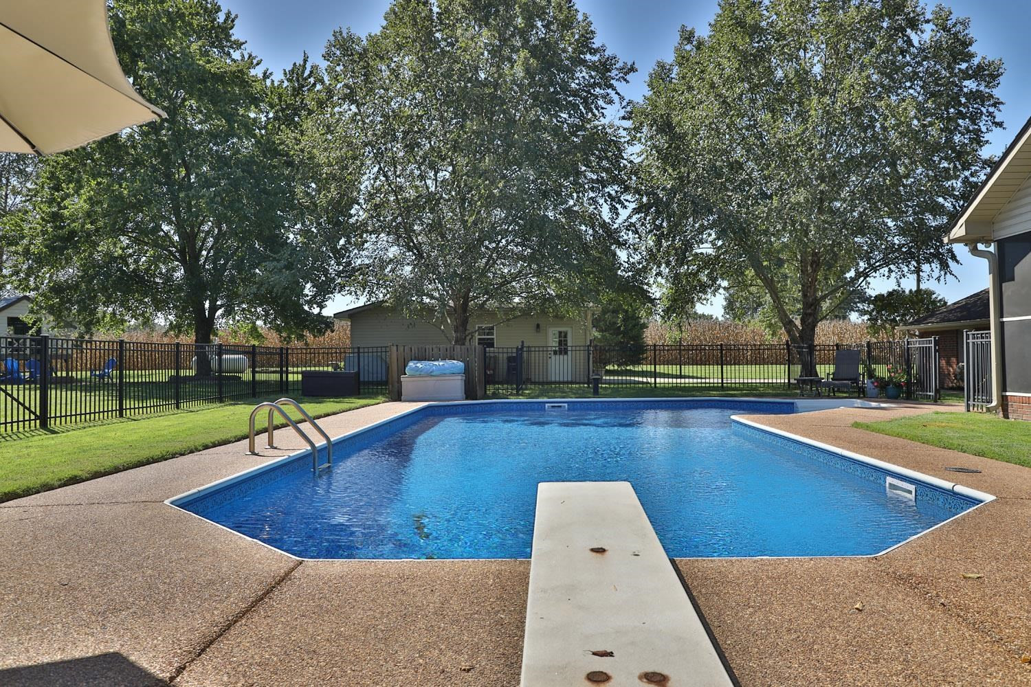 529 Vancleave Road Martin, TN 38237 - Photo 16 of 20 a view of a swimming pool with a yard