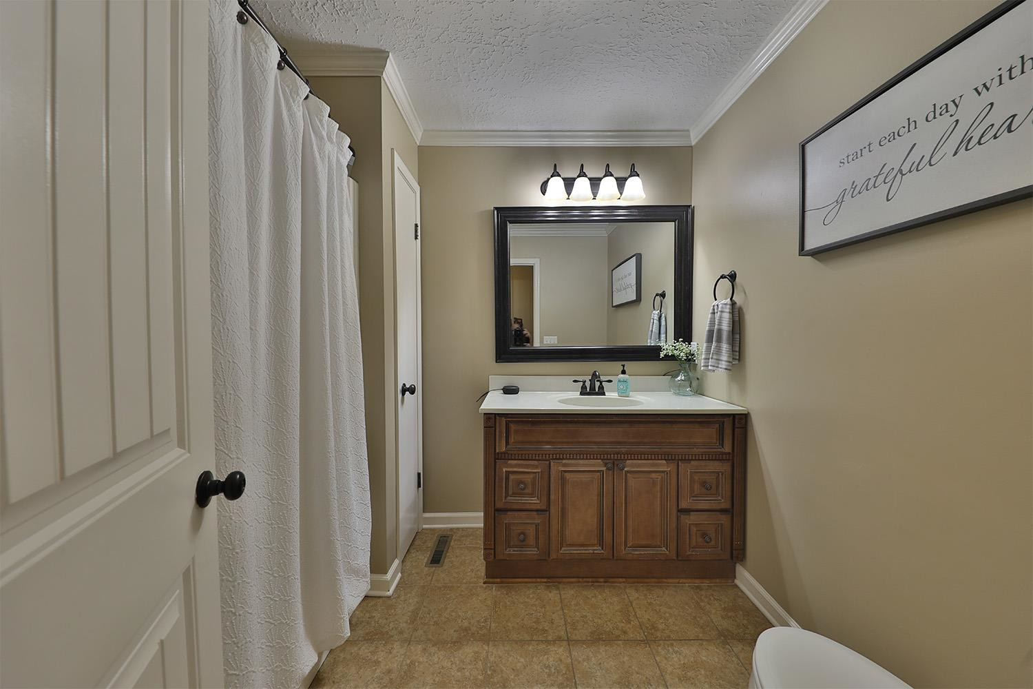 529 Vancleave Road Martin, TN 38237 - Photo 10 of 20 a bathroom with a toilet sink and mirror