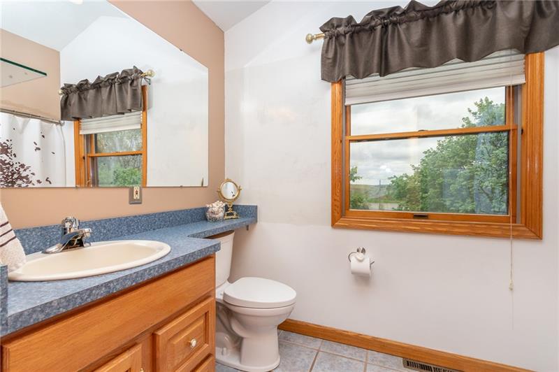 1473 Lovi Road Freedom, PA 15042 - Photo 11 of 22 A large ceramic tiled master bath features vaulted ceilings.